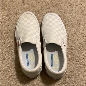 Holographic vans all white checkerboard design.